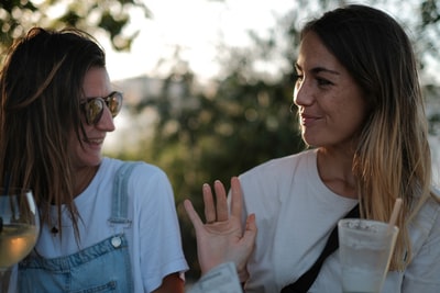 Smile of a woman wearing a white shirt
